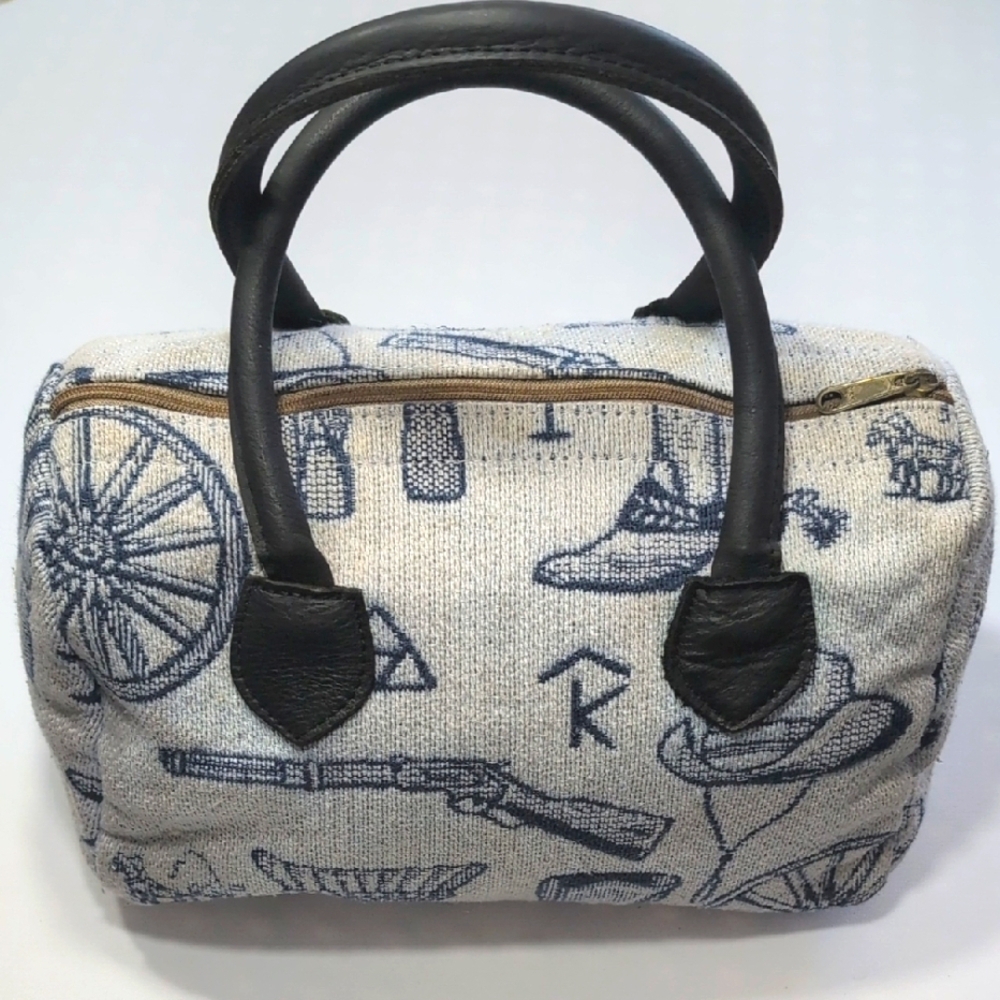Vintage soft side bag W Cowboys And Prairie Motif. Guns, Wheels, Boots, Spurs.